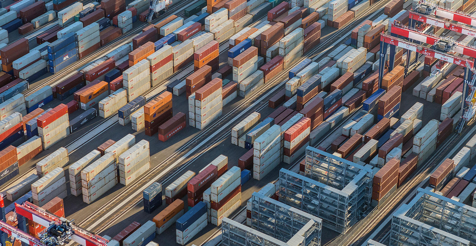Afternoon aerial view of cargo shipping containers stacked on docks, in Los Angeles, US, 18/08/2016